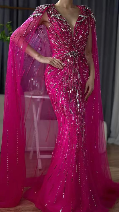 Elegant Fitted Gown with Beaded Details and Dramatic Cape