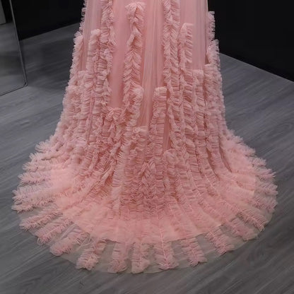 Pink tulle dress with soft pleated embroidery and feminine off-shoulder design