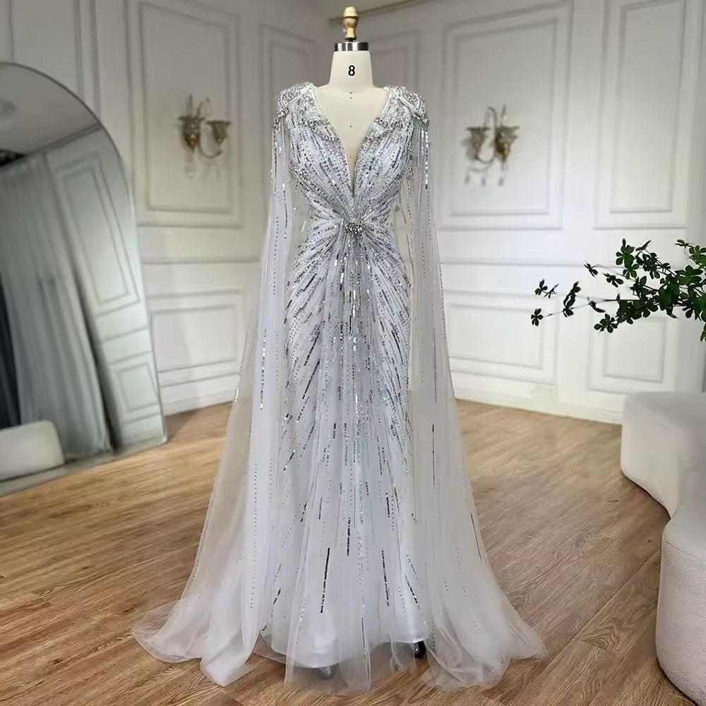 Elegant Fitted Gown with Beaded Details and Dramatic Cape