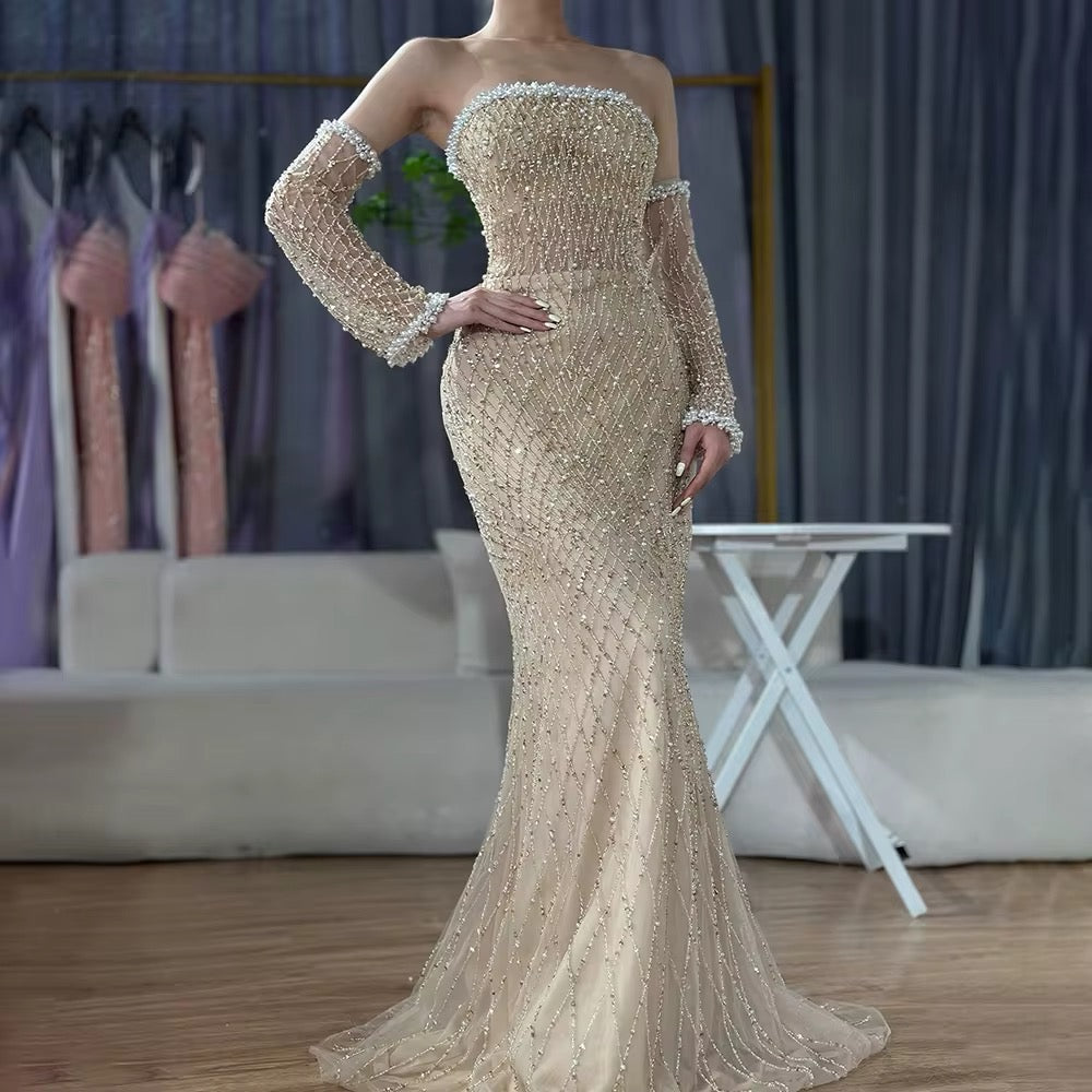 Dress with a pearl-decorated sleeve