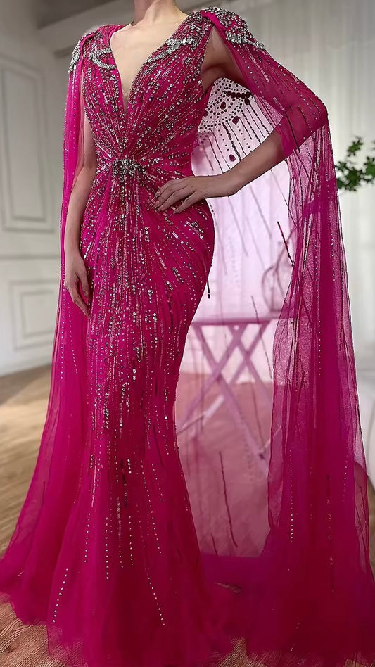 Elegant Fitted Gown with Beaded Details and Dramatic Cape