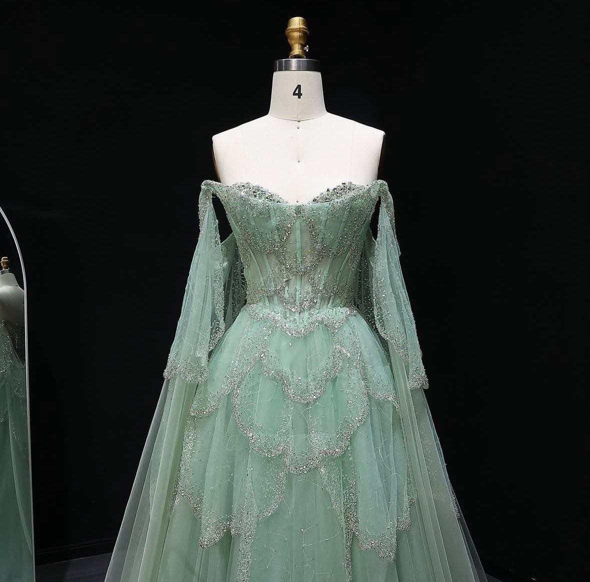 ‏Luxury Sage Green Off-Shoulder Evening Gown with Cape Sleeves