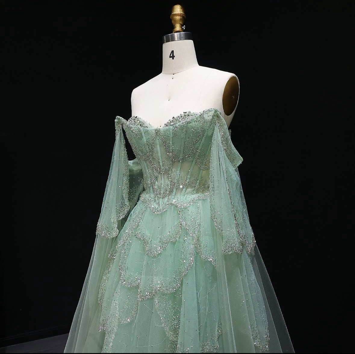 ‏Luxury Sage Green Off-Shoulder Evening Gown with Cape Sleeves