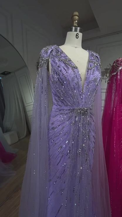 Elegant Fitted Gown with Beaded Details and Dramatic Cape
